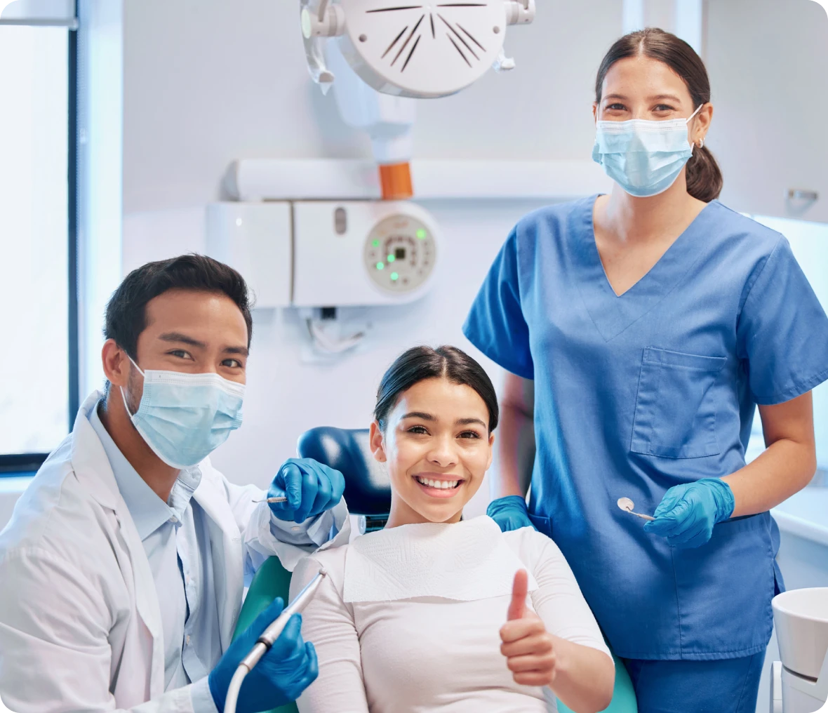 Smiling dental team with patient